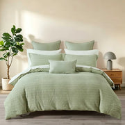 Solene Seafoam waffle duvet cover set with matching pillow shams styled on a bed.